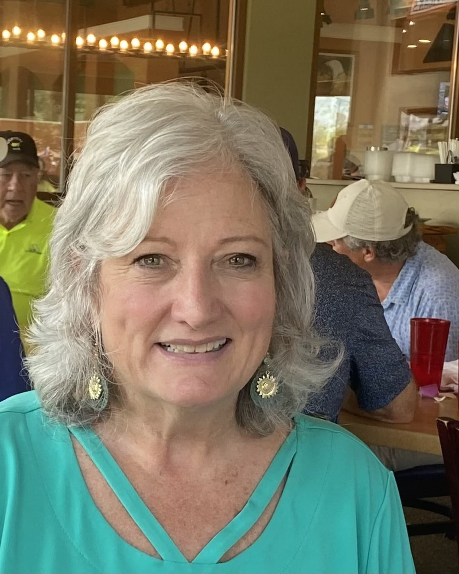 Erin smiling at a restaurant